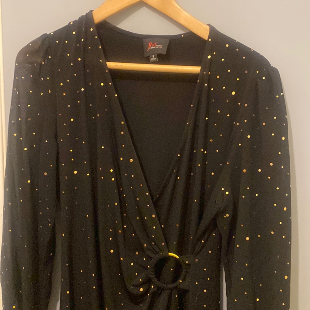 It's JM studio black dress with polkadots and gold very chic